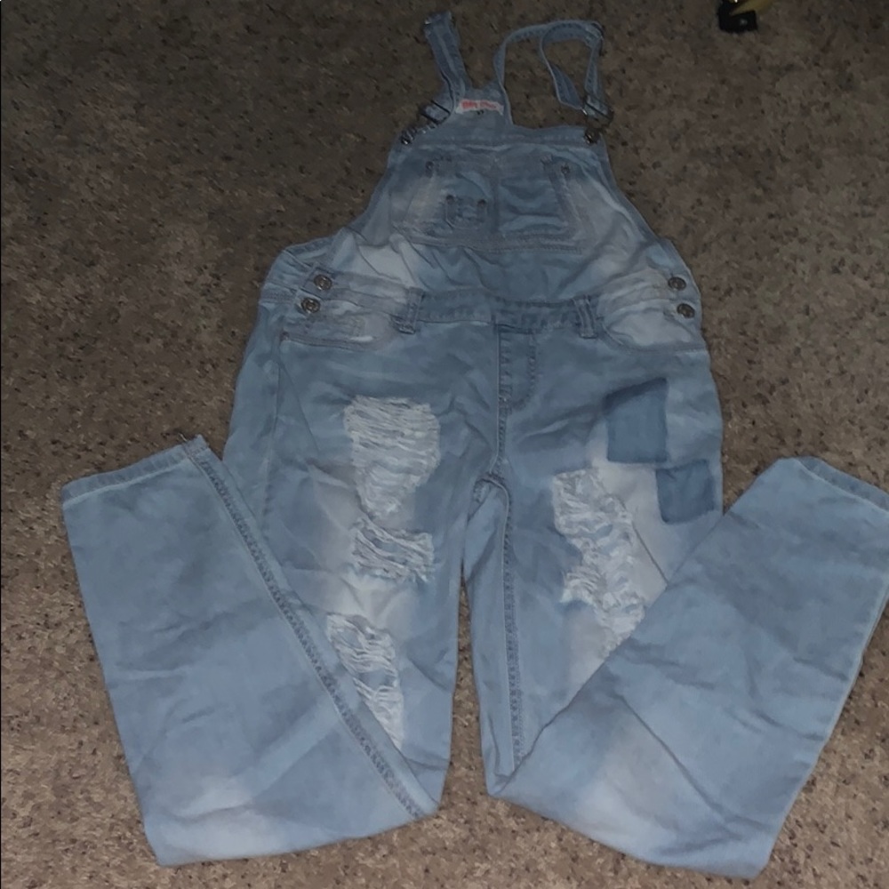 ripped light wash overalls